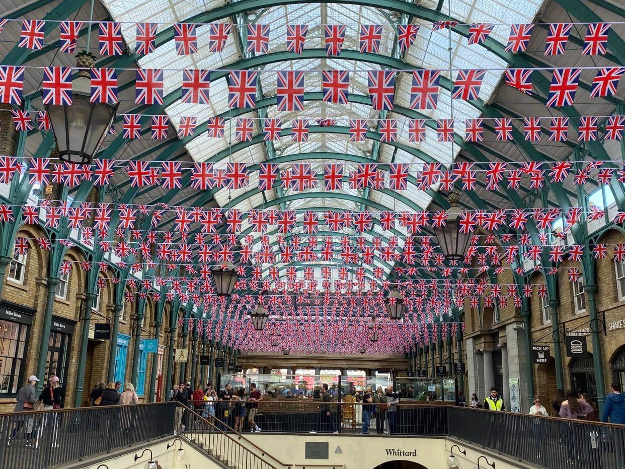 Covent Garden London with British flags above